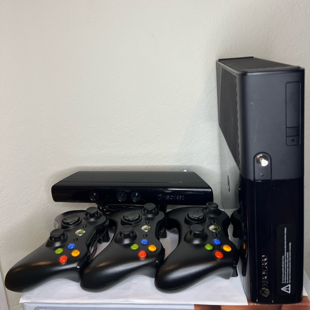 Xbox 360 Console with Kinect included, as well as 3 controllers included.